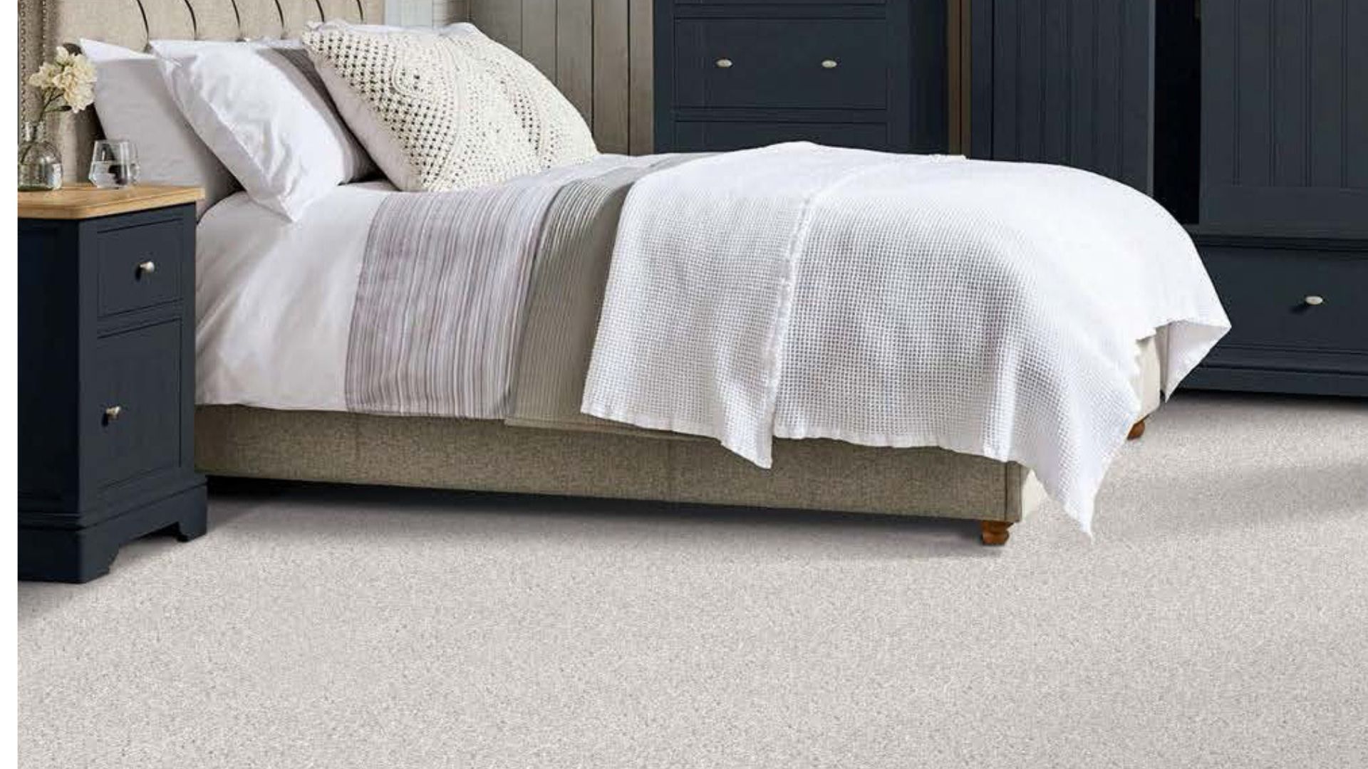 cozy neutral off white carpets in a bedroom